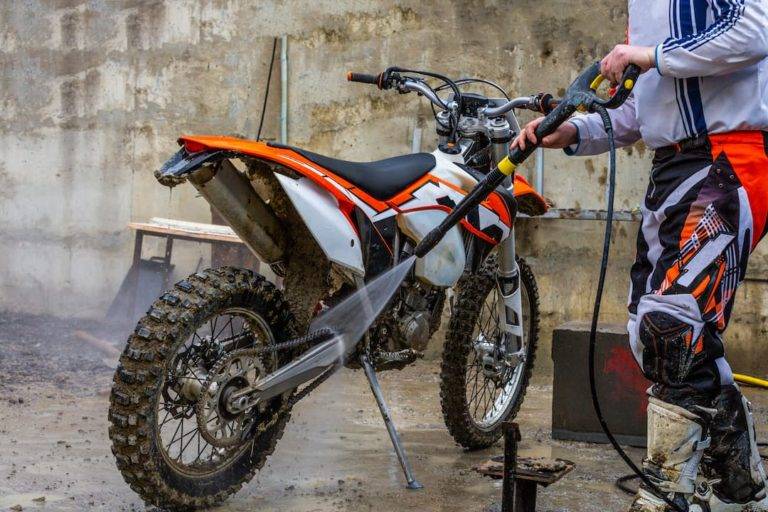 Cleaning a dirt bike with a pressure washer